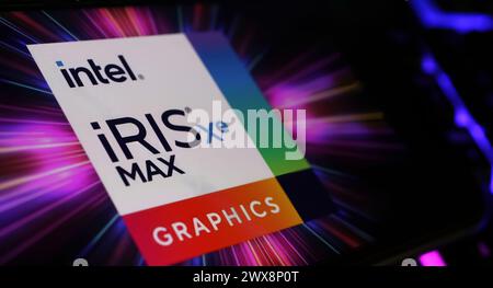 Viersen, Germany - March 9. 2024: Closeup of smartphone on computer keyboard with logo lettering of Intel Iris XE GPU Graphics Stock Photo