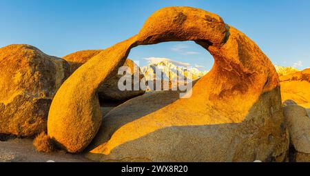 The Snow Capped Sierra Nevada Mountains Framed Inside Mobius Arch, Alabama Hills National Scenic Area, California, USA Stock Photo