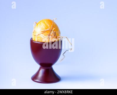 Colored egg. Traditional Easter food and decoration. Stock Photo
