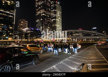 Israel. 26th Mar, 2024. Hundreds of protestors joined family members of the Israeli hostages in a demand for an immediate hostage deal. During the protest family members entered into metal cages placed on the road and afterwards blocked the Ayalon highway. Tel Aviv, Israel. March 26th 2024. (Matan Golan/Sipa USA). Credit: Sipa USA/Alamy Live News Stock Photo