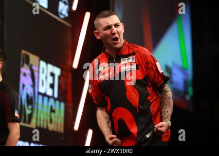 Luke Littler celebrates winning a leg during the BetMGM Premier League ...