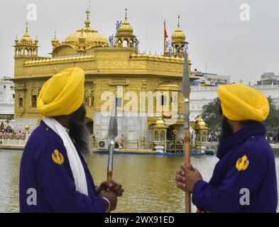 Amritsar, India. 28th Mar, 2024. AMRITSAR, INDIA - MARCH 28: Volunteers from Birmingham's Guru Nanak Nishkam Sewak Jatha in Britain cleans the gold plating at the Golden Temple on March 28, 2024 in Amritsar, India. (Photo by Sameer Sehgal/Hindustan Times/Sipa USA) Credit: Sipa USA/Alamy Live News Stock Photo