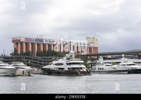 Sydney,Australia luxury superyacht moored at the Sydney superyacht marina in Rozelle Bay beside Glebe silo billboard,NSW,Australia,2024 Stock Photo