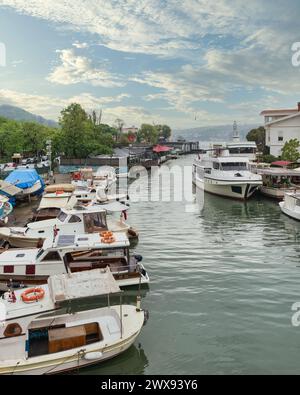 Goksu Stream, with docked group of different shapes, sizes and colors boats, located beside Anadolu Hisari historic castle on the Anatolian side of the Bosporus in Beykoz district, Istanbul, Turkey Stock Photo