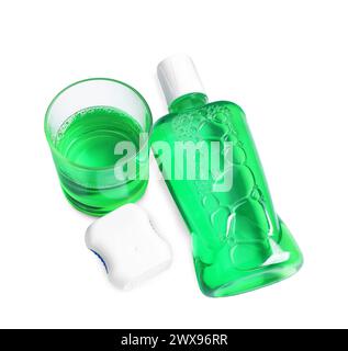 Fresh mouthwash, bottle, glass and dental floss isolated on white, above view Stock Photo