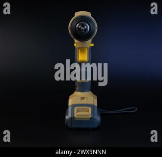 Cordless brushless screwdriver on black background. Stock Photo