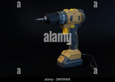 Cordless brushless screwdriver on black background. Stock Photo