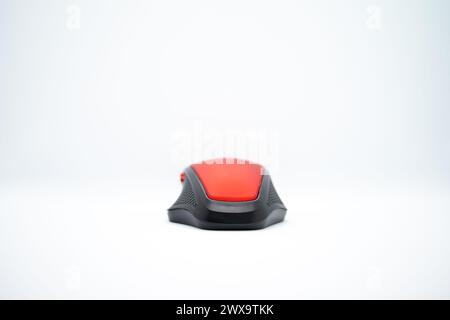 A sleek red mouse on a clean white background, blending style with precision for seamless computer navigation. Stock Photo