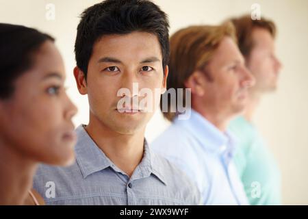 Asian man, diversity and coworker in row for teamwork or collaboration and coworking as graphic designers. Portrait, colleagues and people as Stock Photo