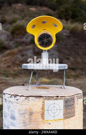 Mini prism for use in surveying on a fixed concrete vertex, monitors movements at a distance Stock Photo