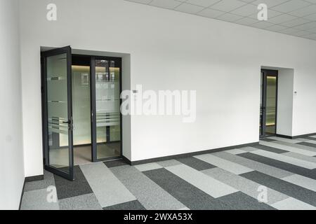 Empty office space With Two Doors and a Checkered Floor Stock Photo