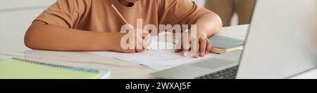 Header with boy doing math homework Stock Photo