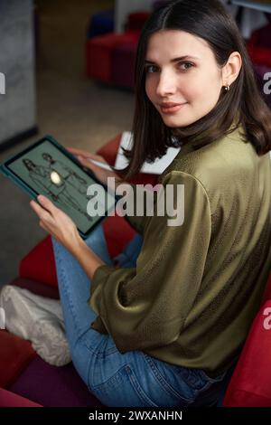 Clothing designer using modern technologies for sketching Stock Photo