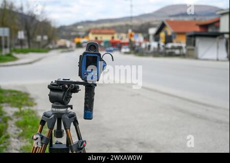 Traffic speed camera measuring speed of vehicles. Police control radar on the road. Radar and camera checking speed of the cars on the street. Speed t Stock Photo