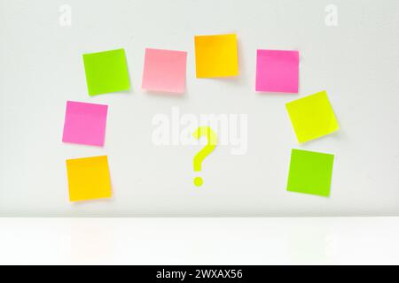 sticky notes with question marks over white Stock Photo