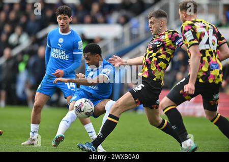 Peterborough, UK. 29th Mar 2024. Malik Mothersille (18 Peterborough United) shoots during the Sky Bet League 1 match between Peterborough and Carlisle United at London Road, Peterborough on Friday 29th March 2024. (Photo: Kevin Hodgson | MI News) Credit: MI News & Sport /Alamy Live News Stock Photo