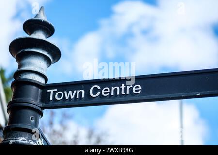 Leatherhead Surrey, UK, March 29 2024, Traditional Town Centre Dircection Sign Post With No People Against A Blue Sky Stock Photo