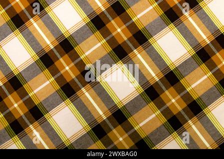 Texture of yellow checkered fabric. Checkered cotton background Stock Photo