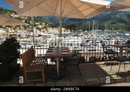 Outside Dining Table In The Marina Of Port De Soller Mallorca On A Wonderful Sunny Spring Day With A Clear Blue Sky Stock Photo