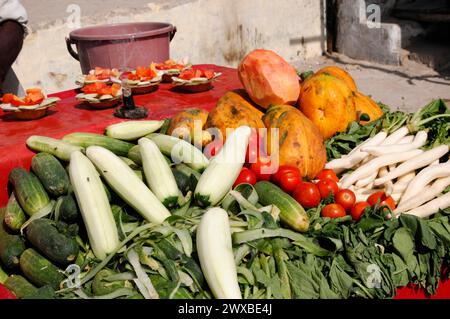 Fresh vegetables presented on a red table at a market stall, Jaipur, Rajasthan, North India, India Stock Photo