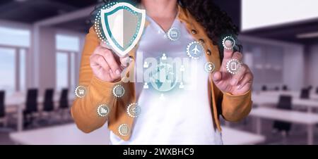 concept. Enterprise security technology, businesswoman touches the security icon in the global network structure. Ensure the secure flow of informatio Stock Photo