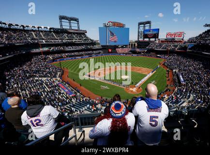 Queens, United States. 29th Mar, 2024. Fans stand for the National Anthem before the New York Mets play the Milwaukee Brewers on opening day at Citi Field on Friday, March 29, 2024 in New York City. Photo by John Angelillo/UPI Credit: UPI/Alamy Live News Stock Photo