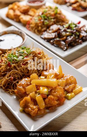 Assorted chinese dishes on wooden table, close up Stock Photo