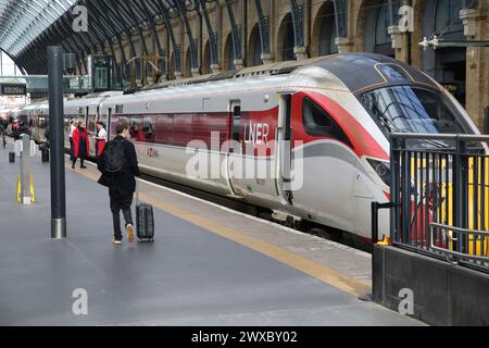 A LNER train waiting at King's Cross station in London. Stock Photo