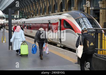 A LNER train waiting at King's Cross station in London. Stock Photo