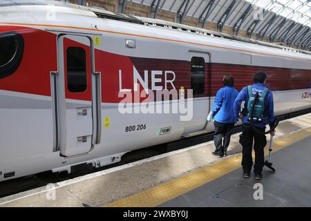 A LNER train waiting at King's Cross station in London. Stock Photo