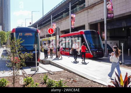 Commuters eagerly board the light rail at Circular Quay station, their anticipation palpable. The sleek, modern trams await, ready to whisk passengers Stock Photo