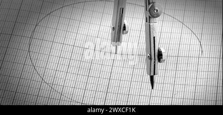 The compasses and a circle painted on graph paper Stock Photo
