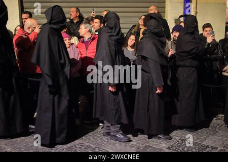 Caserta, Italy. 29th Mar, 2024. People wear black hoods while take part during the Holy Friday procession from Church of San Giovanni to Villa. on March 29, 2024, Caserta, Italy. (Credit Image: © Pasquale Senatore/eyepix via ZUMA Press Wire) EDITORIAL USAGE ONLY! Not for Commercial USAGE! Credit: ZUMA Press, Inc./Alamy Live News Stock Photo