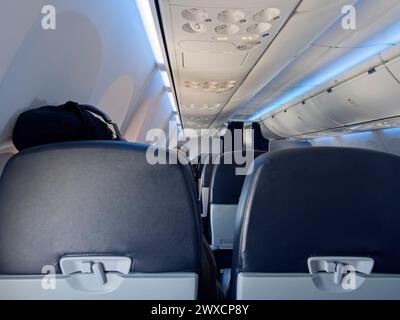 Interior view of an airplane from economy class Stock Photo