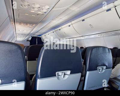 Interior view of an airplane from economy class Stock Photo