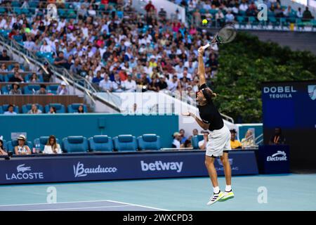 MIAMI GARDENS, FLORIDA - MARCH 29: Alexander Zverev of Germany serves against Grigor Dimitrov of Bulgaria during their match on Day 14 of the Miami Open at Hard Rock Stadium on March 29, 2024 in Miami Gardens, Florida. (Photo by Mauricio Paiz) Stock Photo