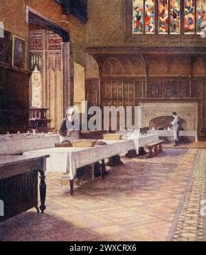 Illustration of the College Dining Hall. Behind the figure of the butler and below the bracket was the frame on which the Latin Bible rested. Watercolour by Edith Danvers Brinton from 'Eton' by Christopher Reynolds Stone, published in 1909. Eton College is a public school in Berkshire, UK. It was founded in 1440 by Henry VI under the name Kynge's College of Our Ladye of Eton besyde Windesore. Stock Photo