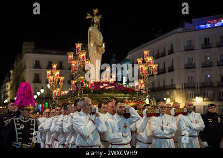 Madrid, Spain. 29th Mar, 2024. Carriers from the Brotherhood of our Father Jesus the Divine Captive carry on their shoulders the procession of the Divine Captive through the streets of Madrid on Good Friday. Seven processions took to the streets of Madrid on Good Friday night. (Photo by Luis Soto/SOPA Images/Sipa USA) Credit: Sipa USA/Alamy Live News Stock Photo