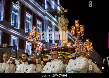 Madrid, Spain. 29th Mar, 2024. Carriers from the Brotherhood of our Father Jesus the Divine Captive carry on their shoulders the procession of the Divine Captive through the streets of Madrid on Good Friday. Seven processions took to the streets of Madrid on Good Friday night. (Photo by Luis Soto/SOPA Images/Sipa USA) Credit: Sipa USA/Alamy Live News Stock Photo