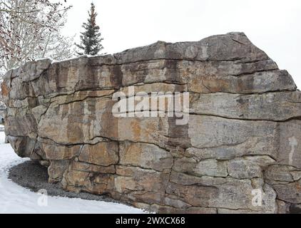 The Buffalo Rubbin Stone was deposited by a glacier 18,000 years ago in Calgary, Canada Stock Photo