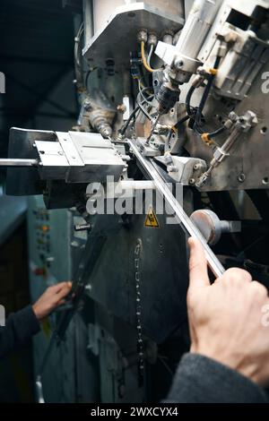 Man uses high-tech equipment to cut a spacer Stock Photo