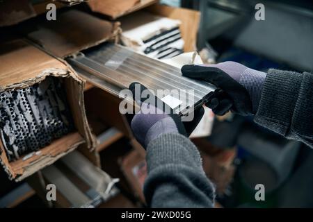 Man uses special parts for the manufacture of double-glazed windows Stock Photo