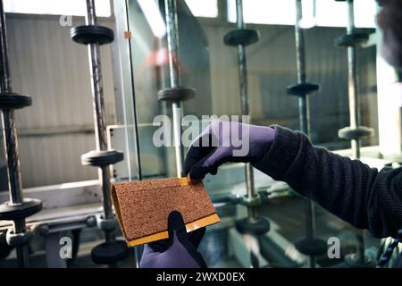 Worker uses special inserts to transport double-glazed windows Stock Photo