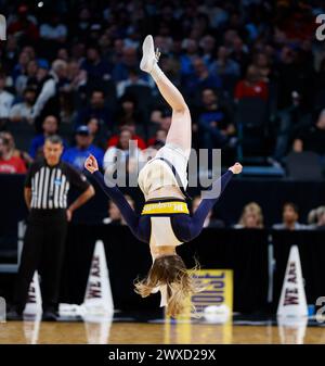 Dallas, Texas, USA. 29th Mar, 2024. A Marquette cheerleader flips during the NCAA Men's Basketball Tournament Regional Semifinal game between NC State and Marquette on March 29, 2024. NC State won, 67-58. (Credit Image: © Scott Coleman/ZUMA Press Wire) EDITORIAL USAGE ONLY! Not for Commercial USAGE! Stock Photo