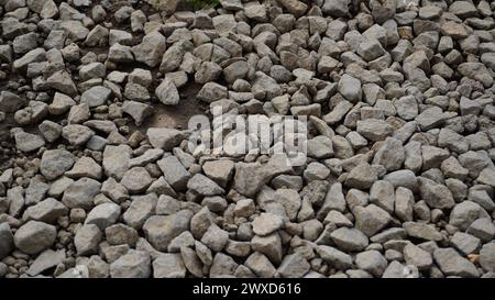 Background of lots of gray pebbles on the road Stock Photo