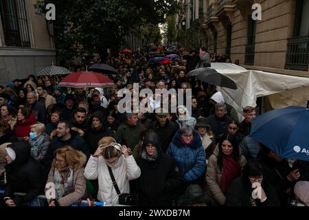 Madrid, Spain. 29th Mar, 2024. A group of Christians of the 'Lord of Madrid' (Cristo de Medinaceli) wait for the Good Friday procession. This Good Friday, the brotherhood of the Primary Archconfraternity of the Real and Illustrious Slavery of Nuestro Padre Jesús Nazareno de Medinaceli, popularly known as 'The Lord of Madrid, has processed like every Good Friday through the streets of the center of Madrid. Credit: SOPA Images Limited/Alamy Live News Stock Photo