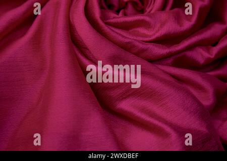 A closeup of pink silk cloth fabric. Stock Photo