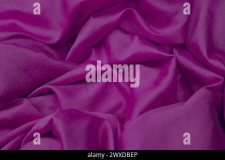 A closeup of pink silk cloth fabric. Stock Photo