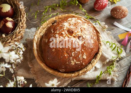 Traditional Czech sweet Easter pastry called mazanec, with eggs dyed with onion skins and decorated  with wax Stock Photo