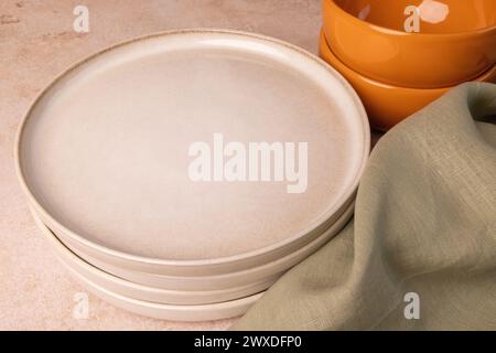 A selection of tableware on a brown stone tabletop. Stock Photo
